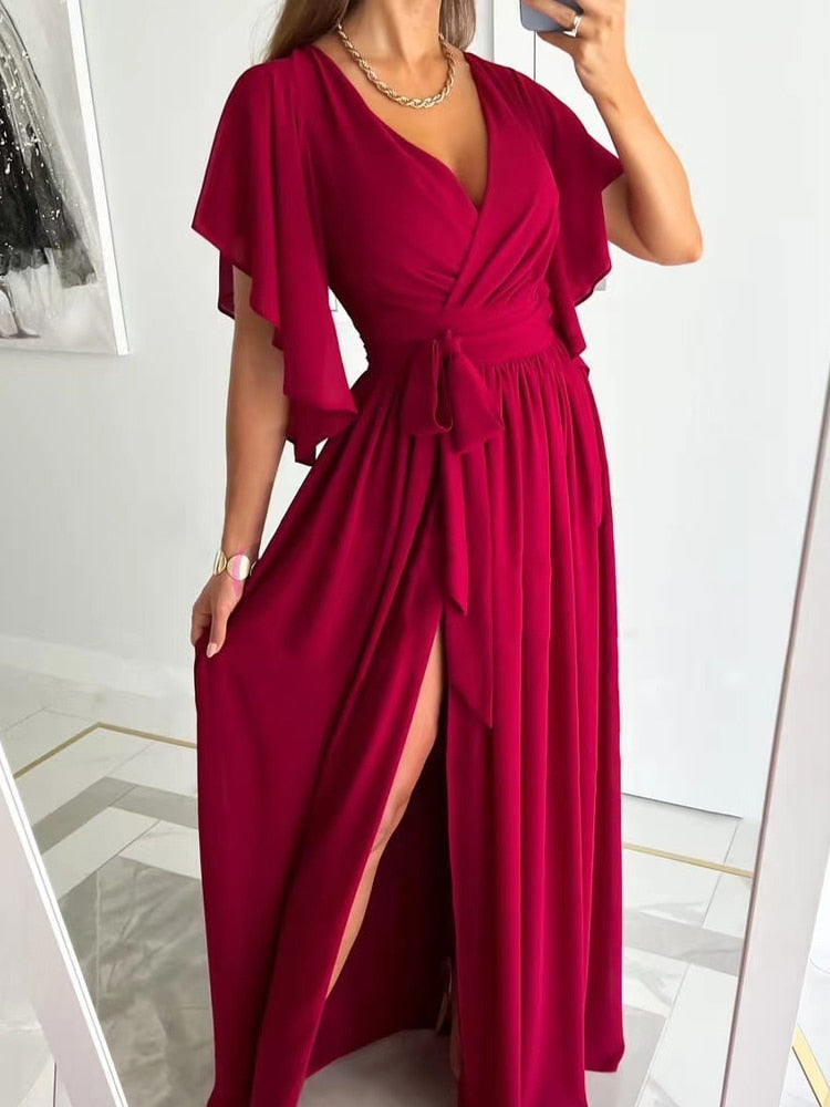 Aitana - Maxi dress sexy con alta spacco, maniche a palloncino e fiocco.