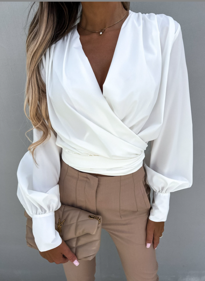 Diora - Blusa alla moda con scollatura a V e eleganti maniche a sbuffo.