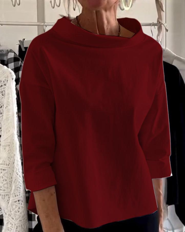 Top da donna elegante con collo alto di tendenza per uno stile unico