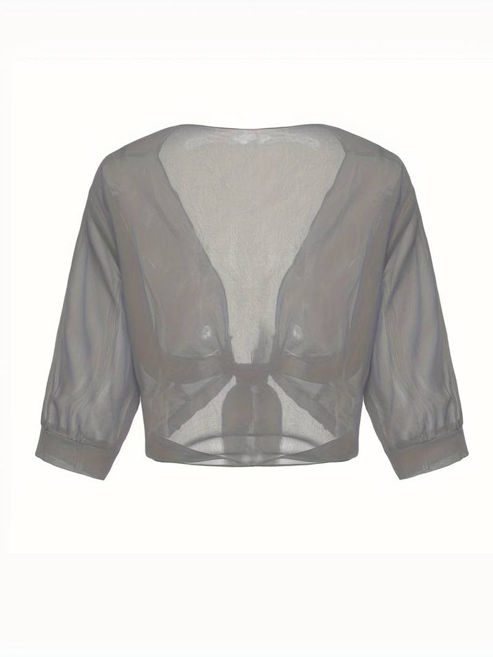<div>Katie – Blusa Elegante con Apertura Fresca sul Davanti</div>