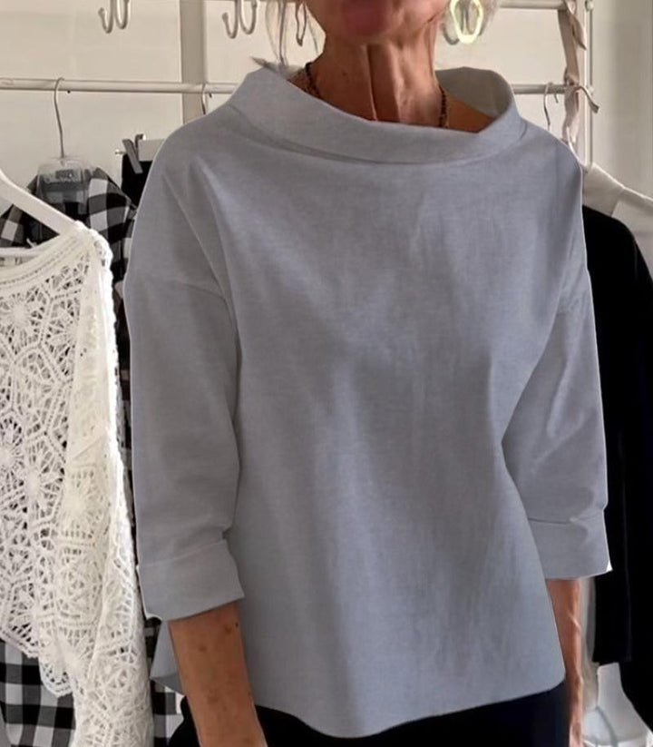 Top da donna elegante con collo alto di tendenza per uno stile unico