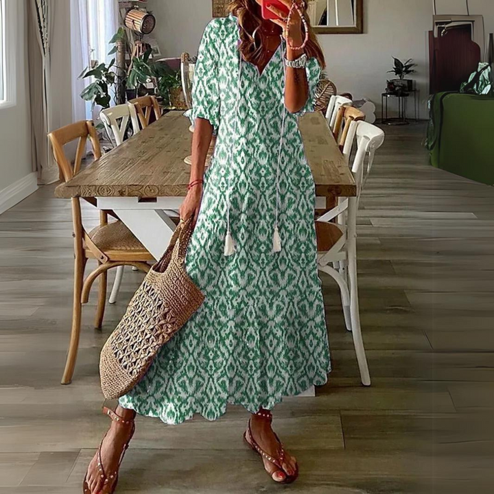 <html>
<head>
</head>
<body>
<p>Lotte - Elegante Maxi Abito con Fantasia di Fiori Vibranti</p>
</body>
</html>