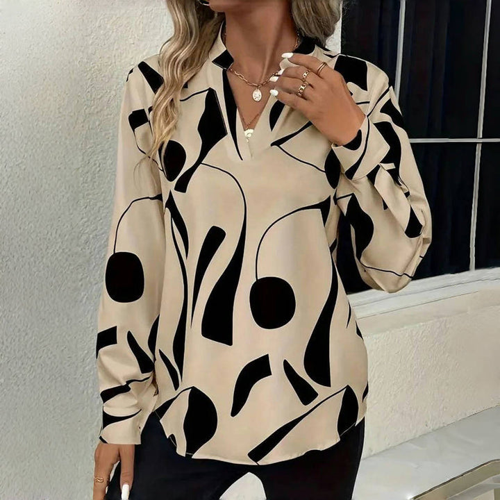 <html><body><p>Izora - Blusa Chic per Donne</p></body></html>