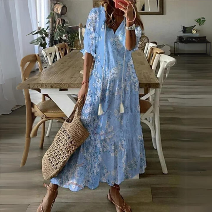 <html>
<head>
</head>
<body>
<p>Lotte - Elegante Maxi Abito con Fantasia di Fiori Vibranti</p>
</body>
</html>
