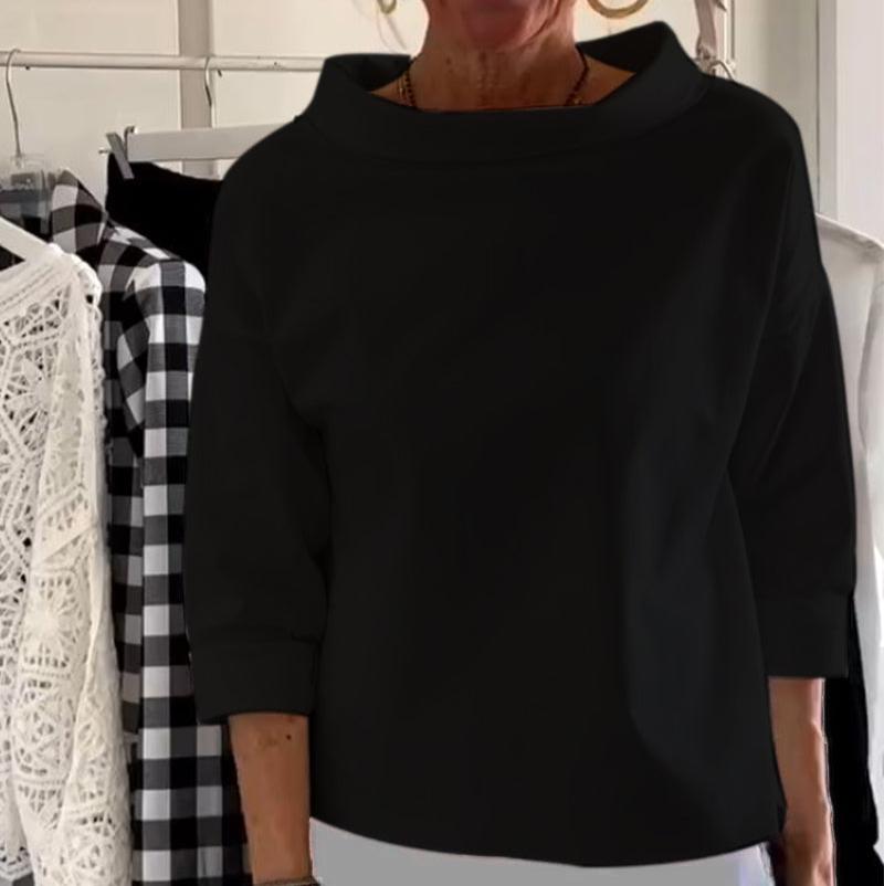 Top da donna elegante con collo alto di tendenza per uno stile unico