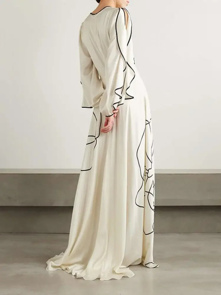 <p>Eline - Abito da sera chic con eleganti maniche arricciate e stampa floreale.</p>
