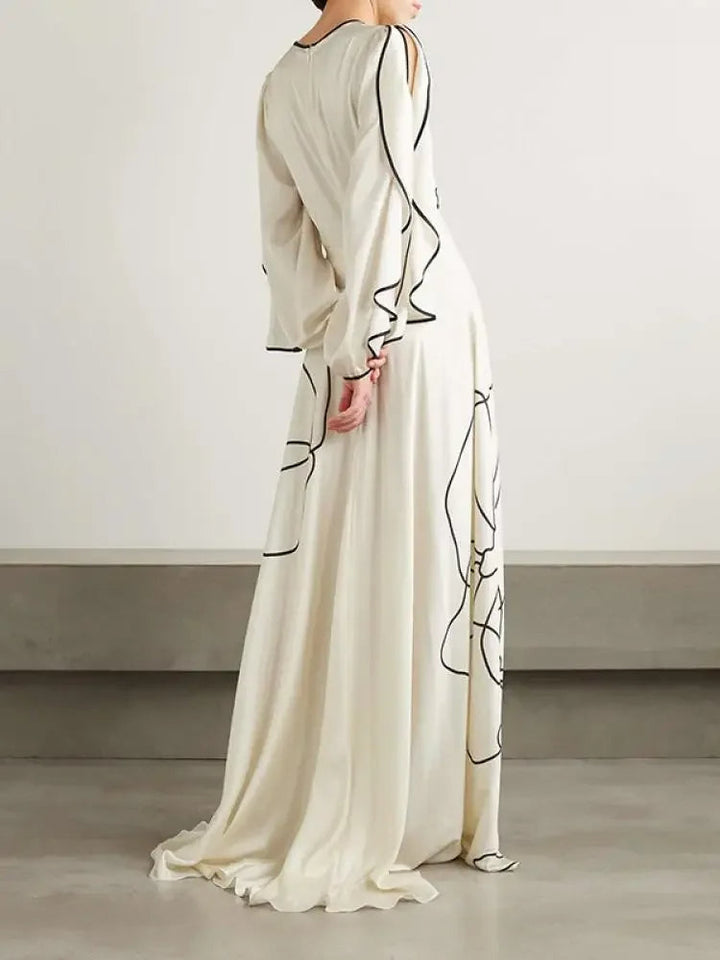 <p>Eline - Abito da sera chic con eleganti maniche arricciate e stampa floreale.</p>