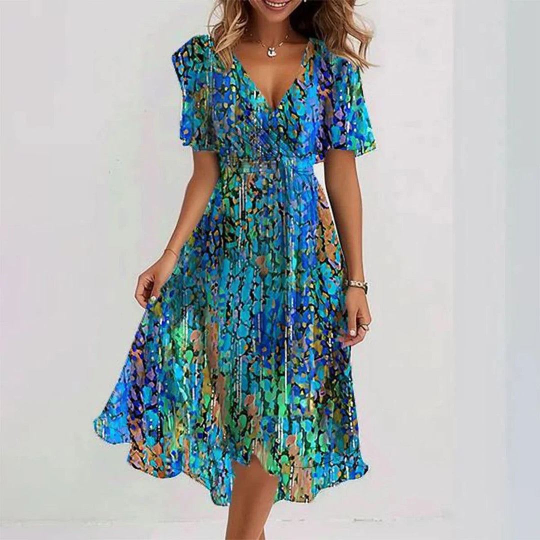 <div>Odilia - Elegante abito midi avvolgente con stampa alla moda</div>
