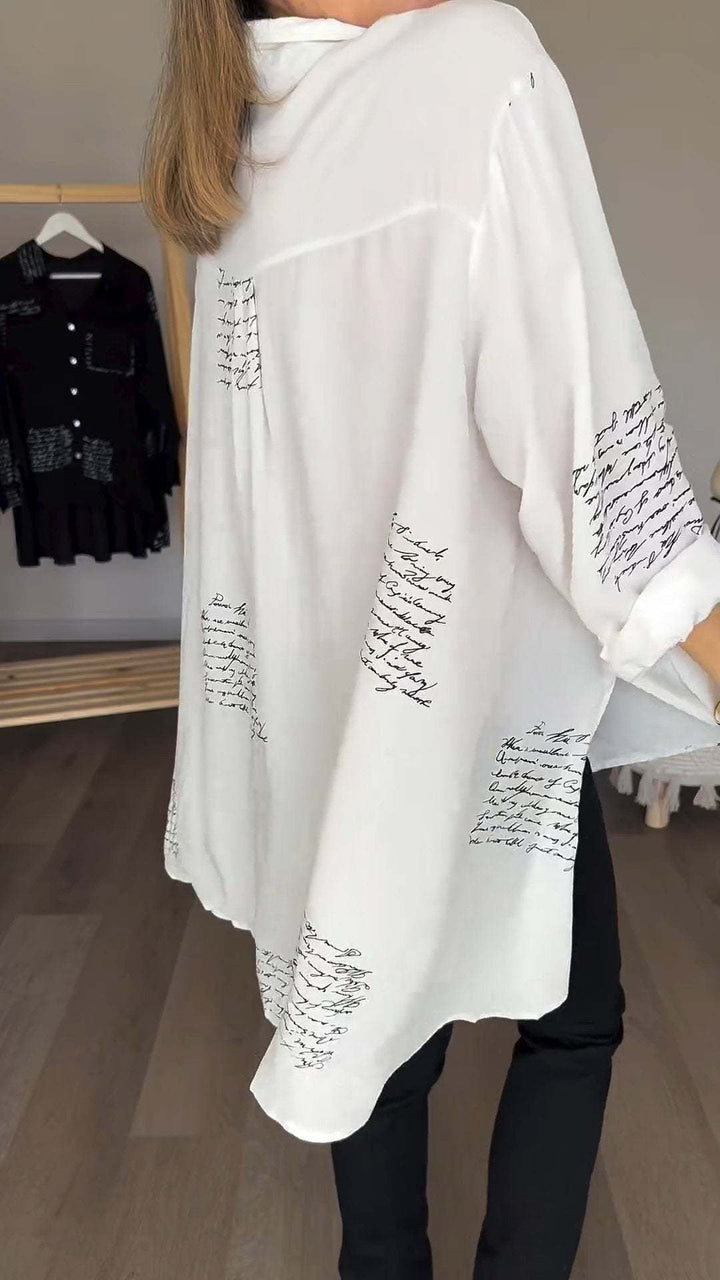 <p>Noëlla - Blusa Artistica Unica con Stampa Scritta a Mano Elegante</p>