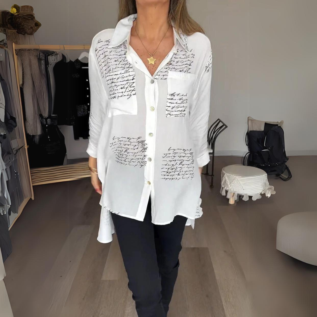 <p>Noëlla - Blusa Artistica Unica con Stampa Scritta a Mano Elegante</p>