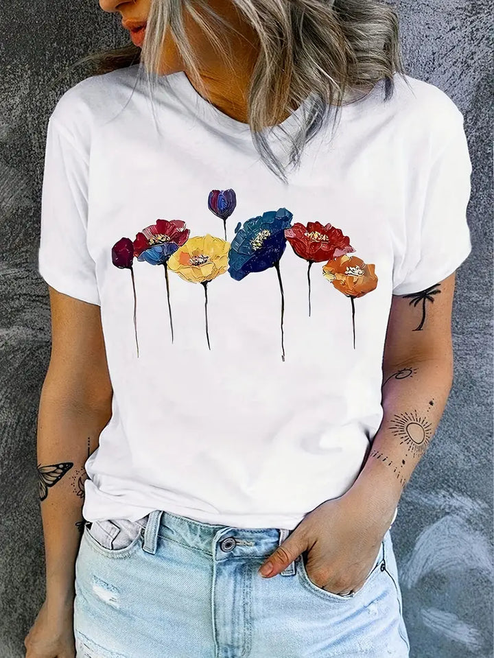 Elegante T-shirt bianca da donna con stampa floreale - perfetta per le calde giornate estive