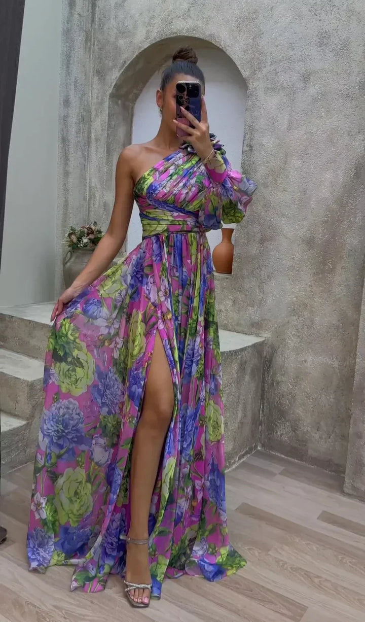 <html><body><p>Bertha - Elegante maxi dress con spalla singola e stampa floreale</p></body></html>