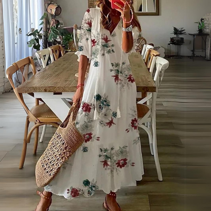 <html>
<head>
</head>
<body>
<p>Lotte - Elegante Maxi Abito con Fantasia di Fiori Vibranti</p>
</body>
</html>