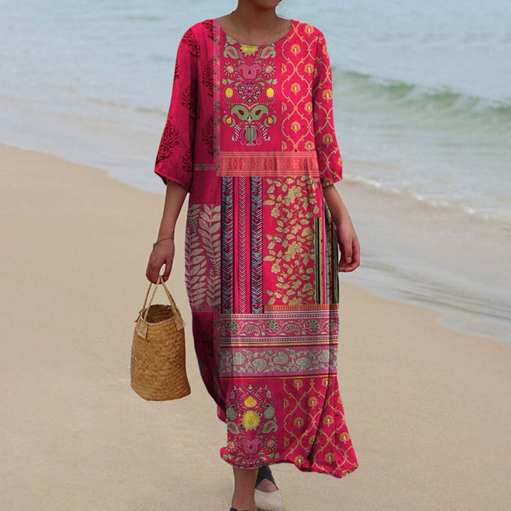 <html>
  <body>
    <p>Noëmie - Elegante Abito Maxi Etnico per un Look Fluido</p>
  </body>
</html>