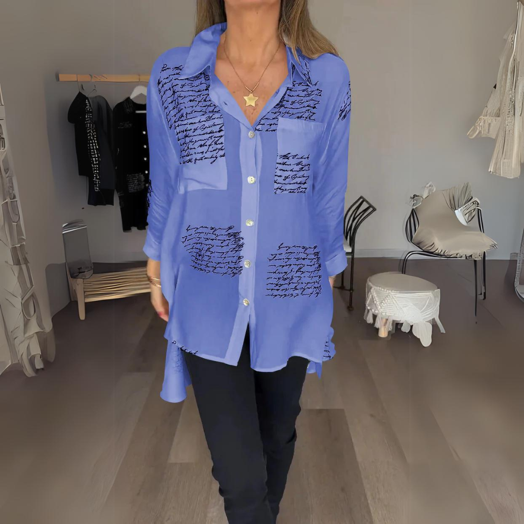 <p>Noëlla - Blusa Artistica Unica con Stampa Scritta a Mano Elegante</p>