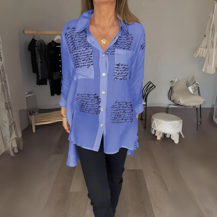 <p>Noëlla - Blusa Artistica Unica con Stampa Scritta a Mano Elegante</p>