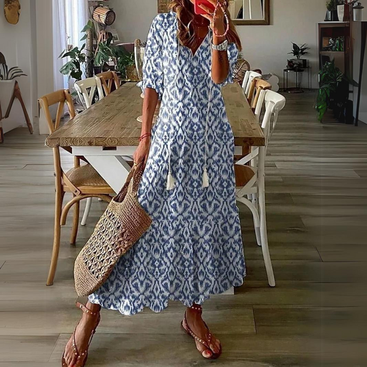 <html>
<head>
</head>
<body>
<p>Lotte - Elegante Maxi Abito con Fantasia di Fiori Vibranti</p>
</body>
</html>