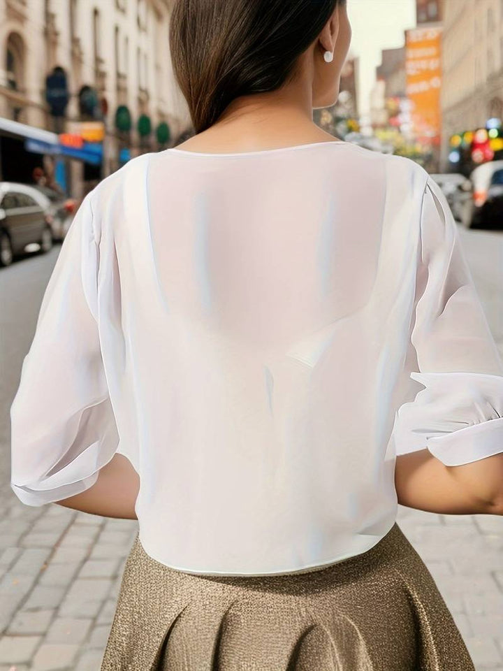 <div>Katie – Blusa Elegante con Apertura Fresca sul Davanti</div>