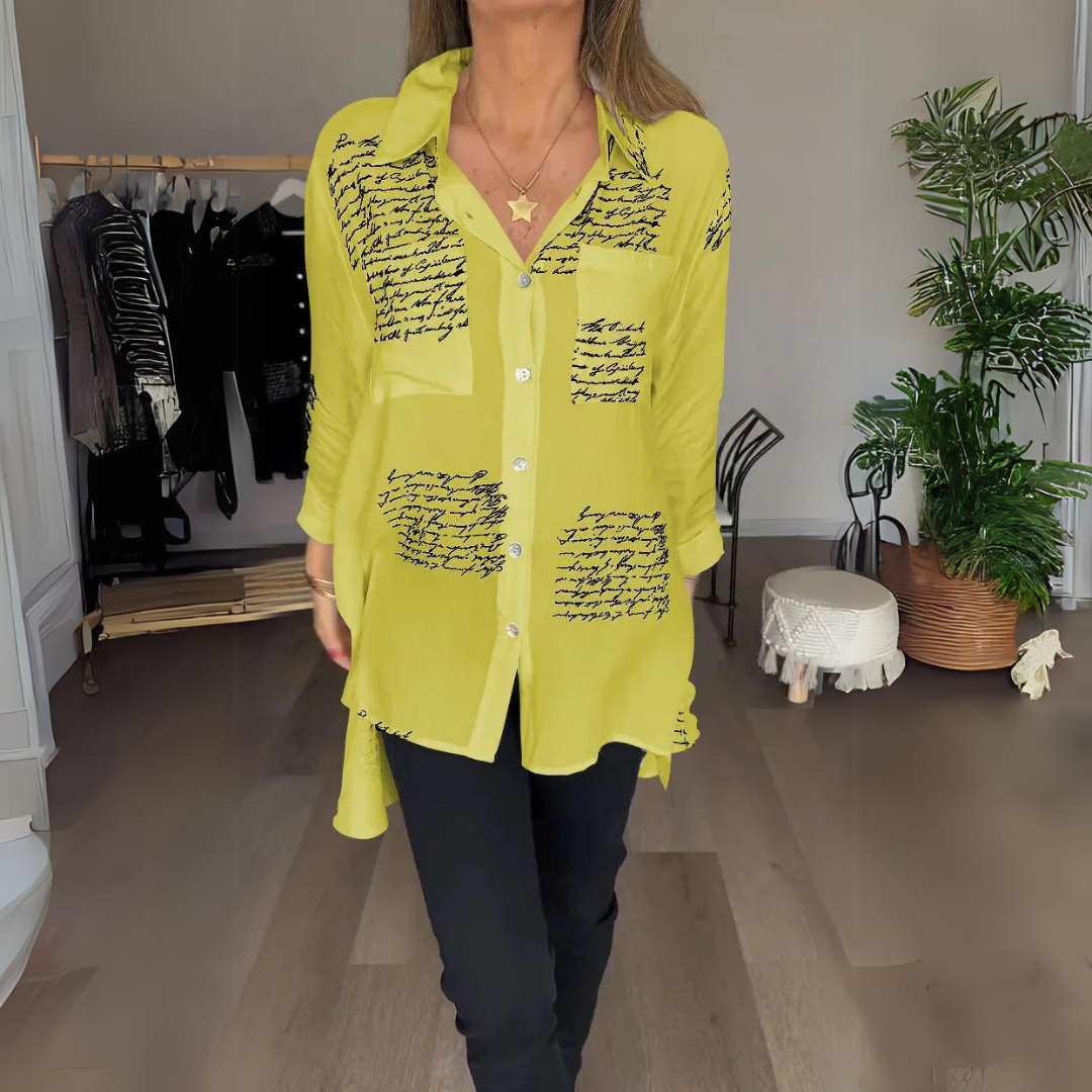 <p>Noëlla - Blusa Artistica Unica con Stampa Scritta a Mano Elegante</p>