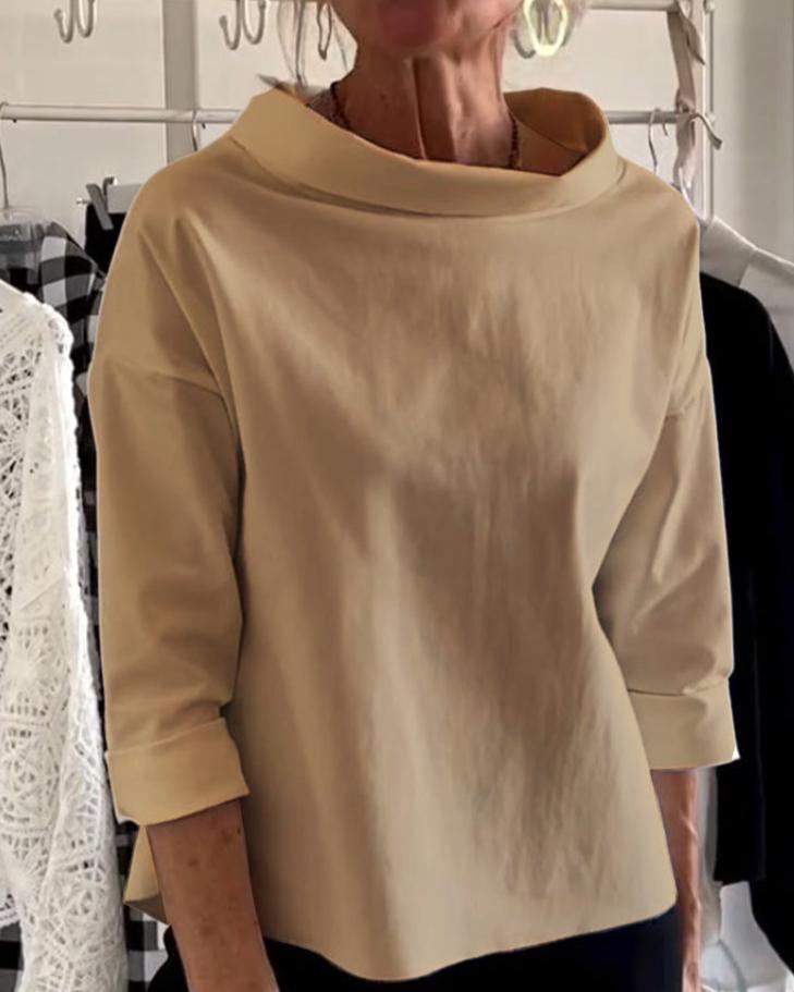 Top da donna elegante con collo alto di tendenza per uno stile unico