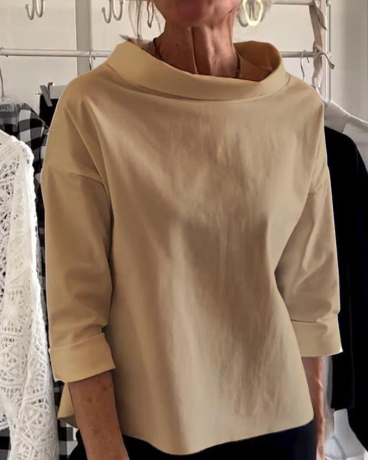 Top da donna elegante con collo alto di tendenza per uno stile unico