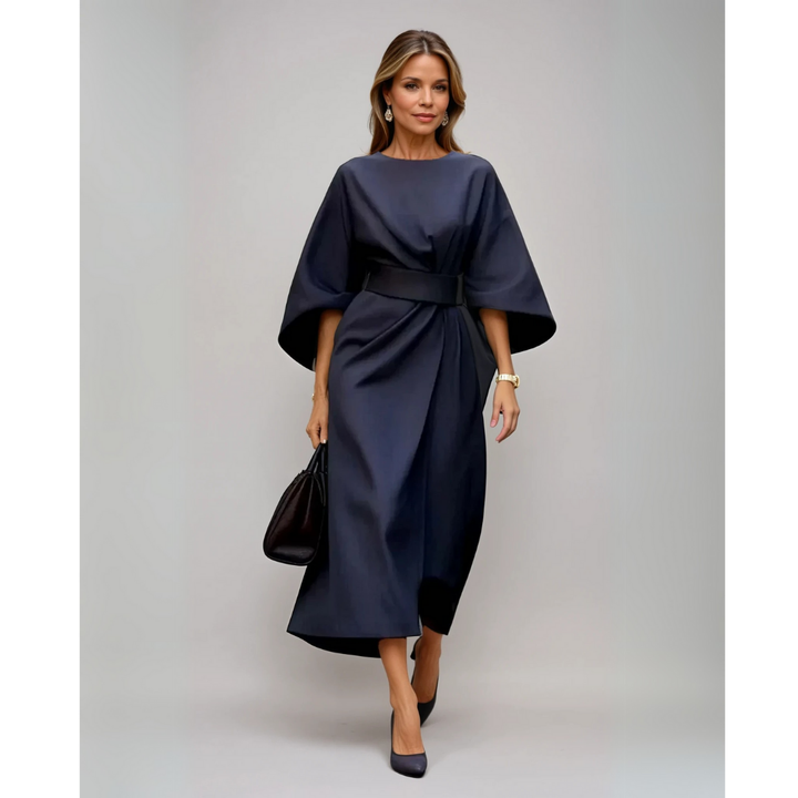 <html>
<body>
<p>Selva | Abito elegante con splendidi maniche a lanterna e una cintura che valorizza la silhouette.</p>
</body>
</html>