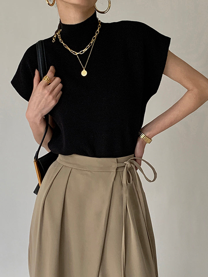 <html><body><p>Ismara - Top Elegante con Collo Alto Chic</p></body></html>