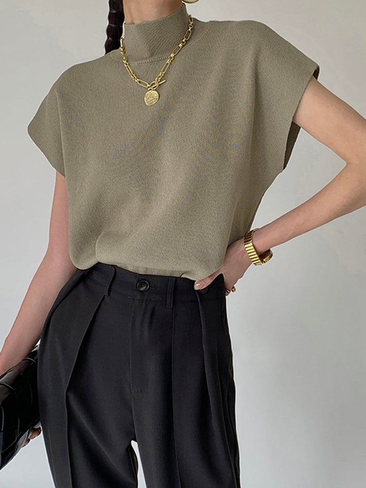 <html><body><p>Ismara - Top Elegante con Collo Alto Chic</p></body></html>