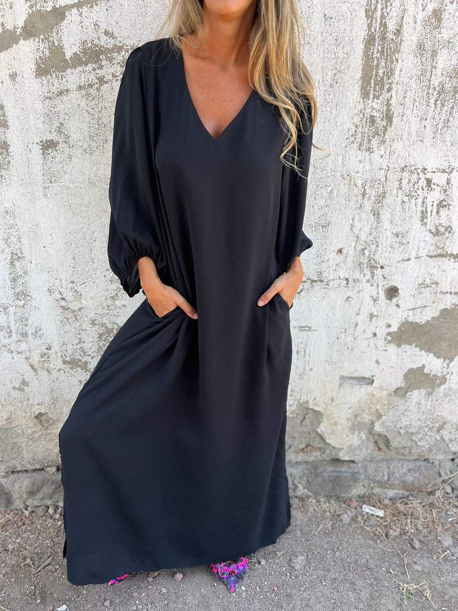 Maxi abito da donna elegante con scollatura a punta - ideale per le occasioni speciali