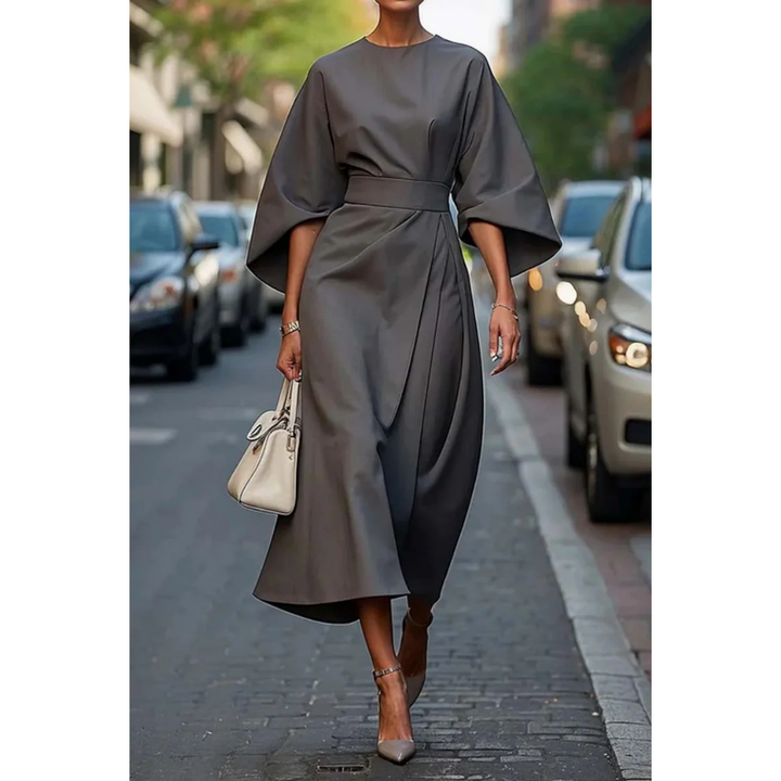 <html>
<body>
<p>Selva | Abito elegante con splendidi maniche a lanterna e una cintura che valorizza la silhouette.</p>
</body>
</html>