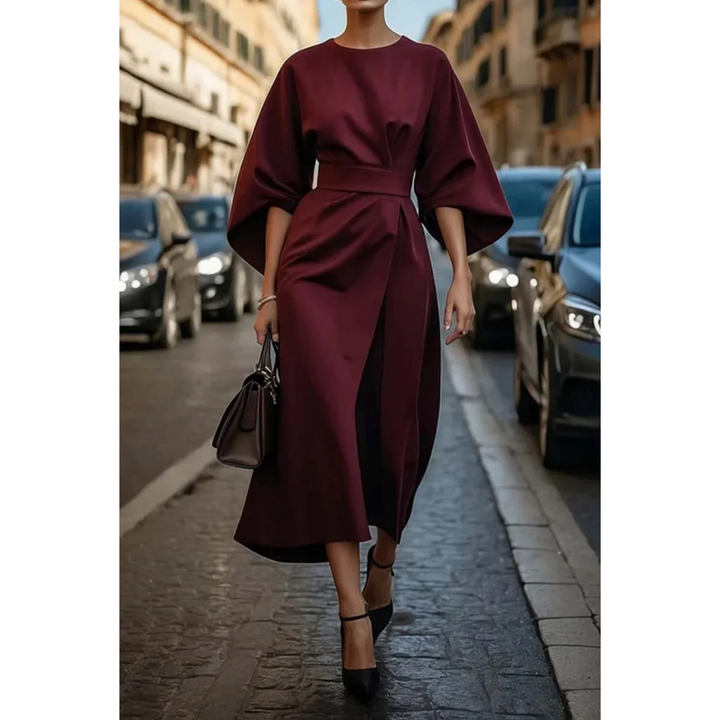 <html>
<body>
<p>Selva | Abito elegante con splendidi maniche a lanterna e una cintura che valorizza la silhouette.</p>
</body>
</html>