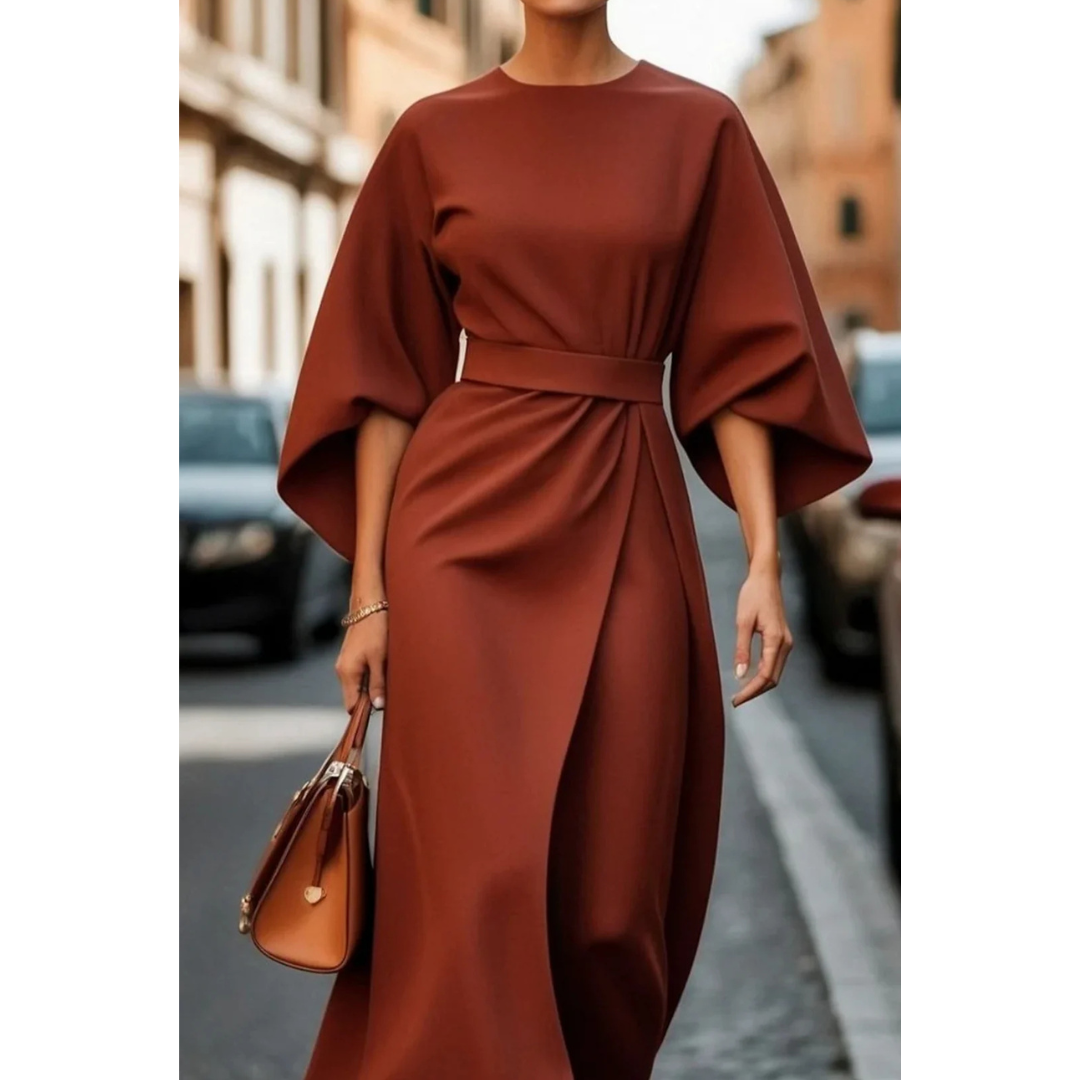 <html>
<body>
<p>Selva | Abito elegante con splendidi maniche a lanterna e una cintura che valorizza la silhouette.</p>
</body>
</html>