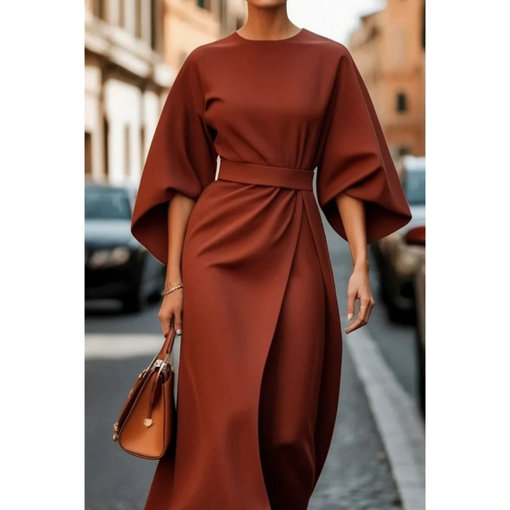 <html>
<body>
<p>Selva | Abito elegante con splendidi maniche a lanterna e una cintura che valorizza la silhouette.</p>
</body>
</html>