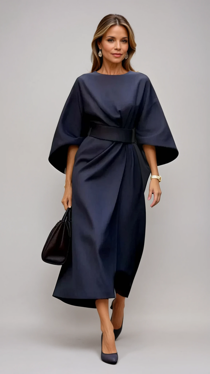 <html>
<body>
<p>Selva | Abito elegante con splendidi maniche a lanterna e una cintura che valorizza la silhouette.</p>
</body>
</html>