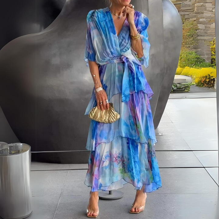 <html><body>Lavinia - Elegante maxi-abito con un raffinato top avvolgente.</body></html>