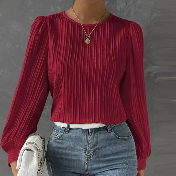 Elegante camicetta da donna plissettata ideale per le occasioni speciali