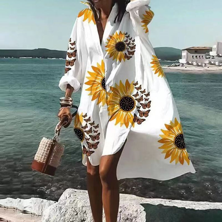 Abito elegante e femminile con profonda scollatura e eleganti maniche lunghe