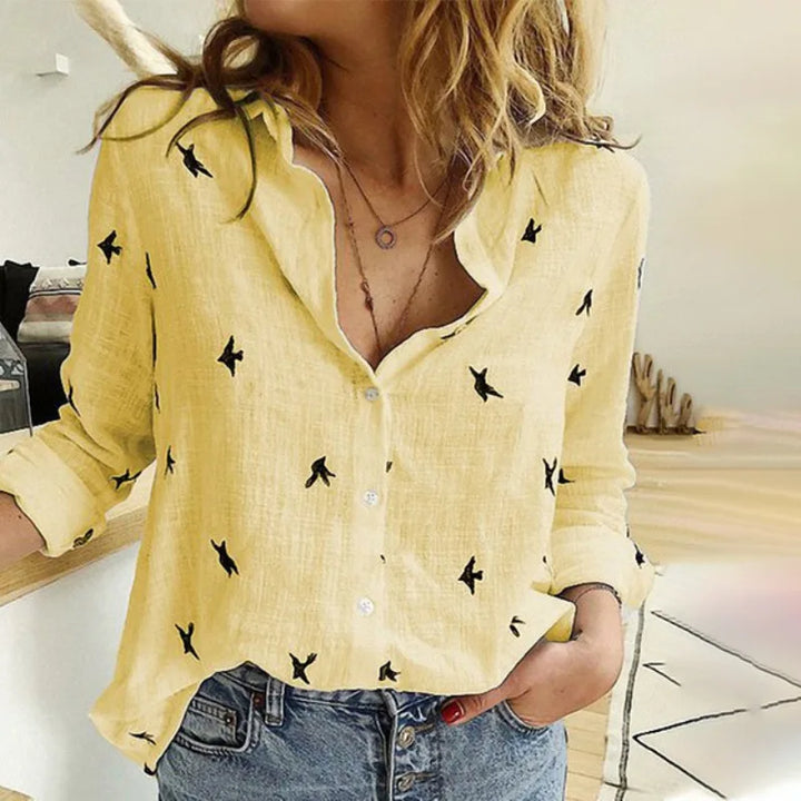 Elegante camicia da donna a maniche lunghe con design a uccello ed elegante chiusura a bottoni