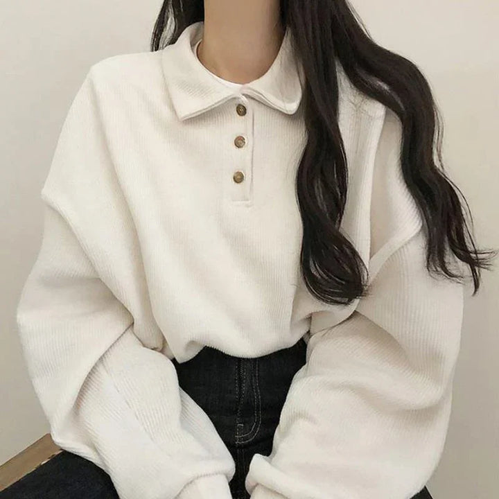 Elegante camicetta da donna a maniche lunghe con colletto unico, che aggiunge eleganza e classe