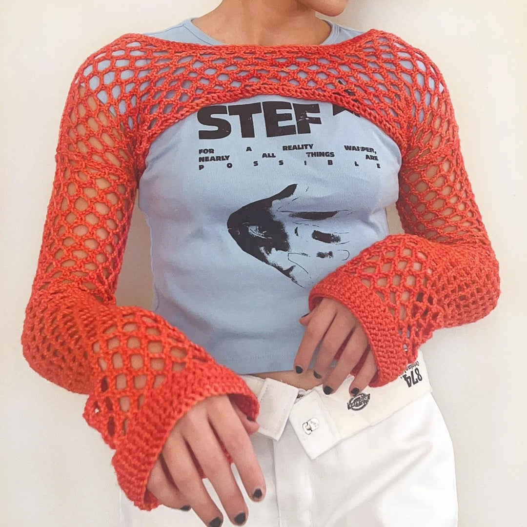 Top da donna alla moda in rete trasparente: una scelta elegante e di classe