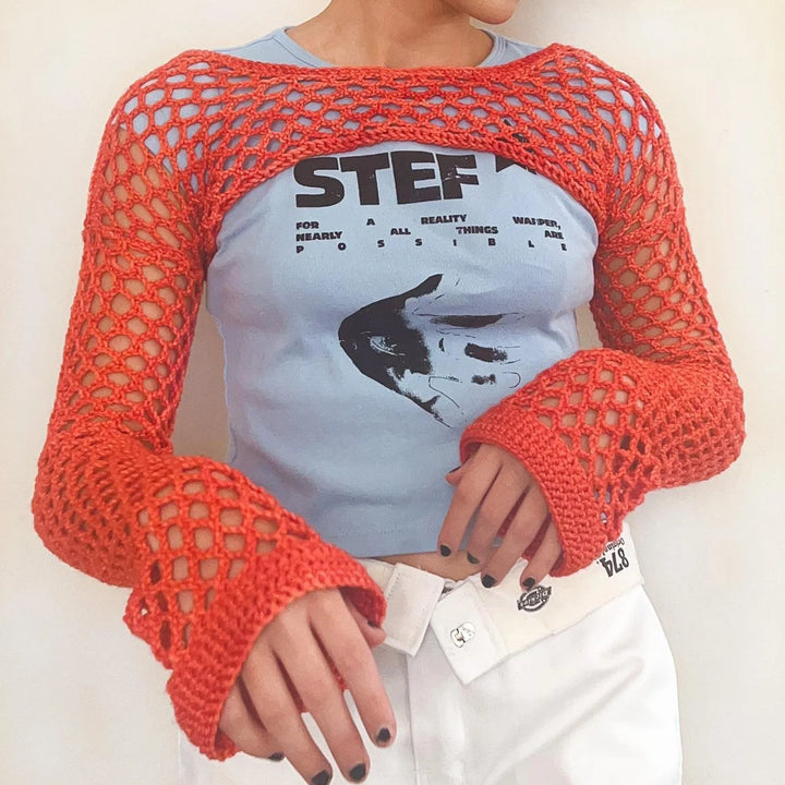 Top da donna alla moda in rete trasparente: una scelta elegante e di classe