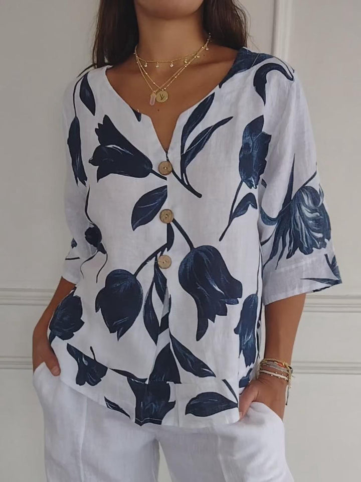 Elegante camicia estiva da donna con motivo floreale e pratica chiusura a bottoni