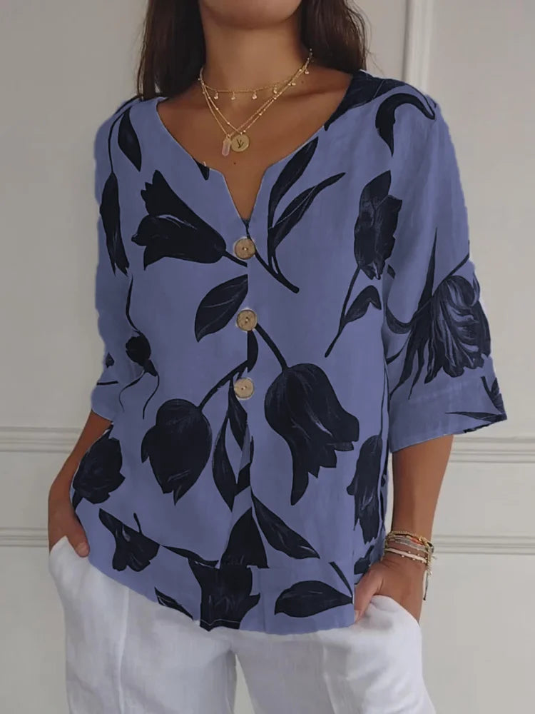 Elegante camicia estiva da donna con motivo floreale e pratica chiusura a bottoni