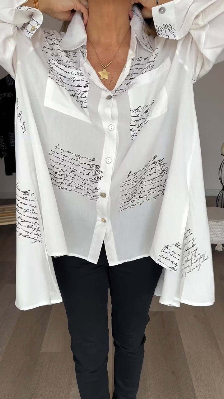 <p>Noëlla - Blusa Artistica Unica con Stampa Scritta a Mano Elegante</p>