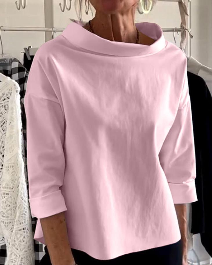 Top da donna elegante con collo alto di tendenza per uno stile unico