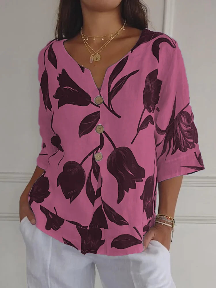 Elegante camicia estiva da donna con motivo floreale e pratica chiusura a bottoni