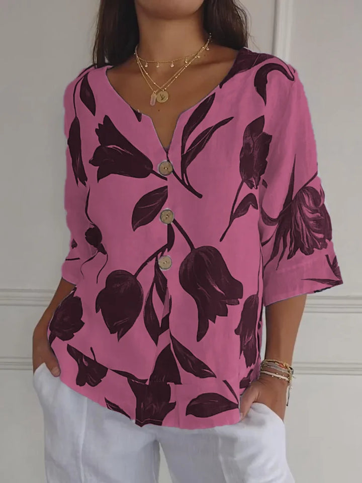 Elegante camicia estiva da donna con motivo floreale e pratica chiusura a bottoni