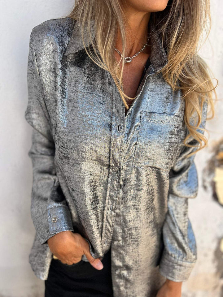 Elegante camicetta metallica da donna con colletto alla moda e design moderno