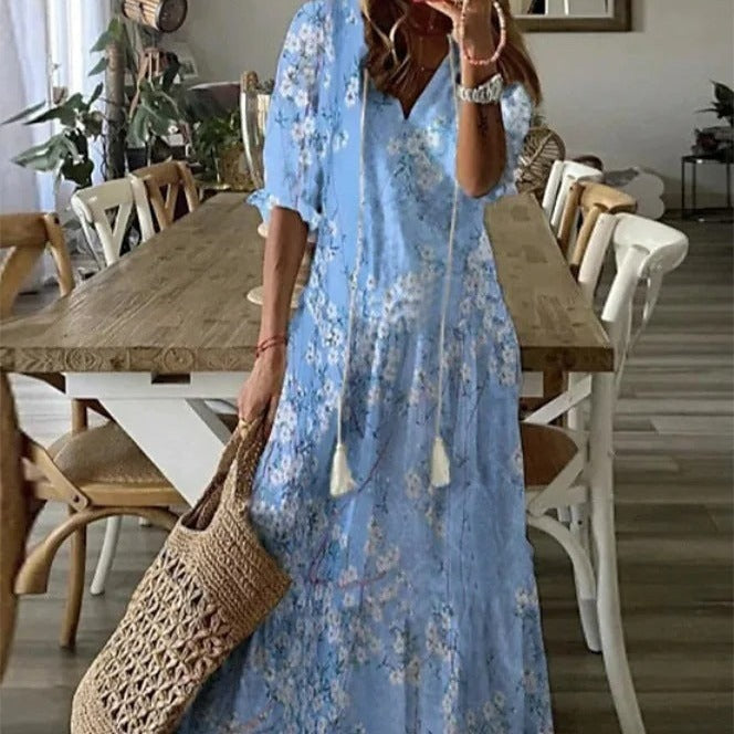 <html><body><p>Lilly - Elegante maxi dress con stampa floreale e maniche a metà con scollatura a V</p></body></html>