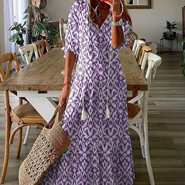 <html><body><p>Lilly - Elegante maxi dress con stampa floreale e maniche a metà con scollatura a V</p></body></html>
